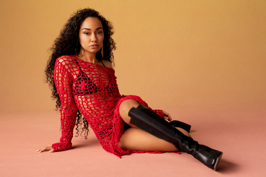 Leigh-Anne poses in a red crochet mesh top and black knee-high boots at Brighton Pride 2026
