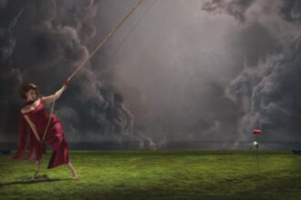 `RAYE pulling a rope against storm clouds, 'This Music May Contain Hope' (2026)`