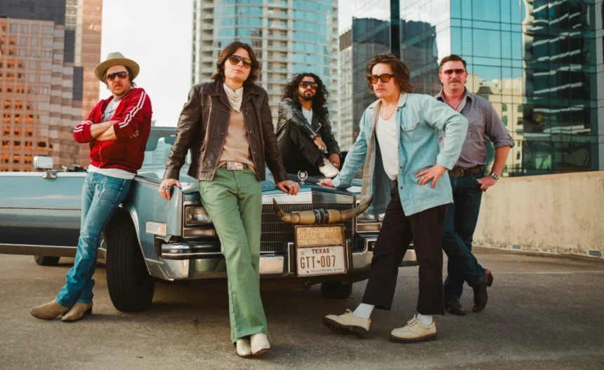 Silverada posed in front of a vintage Texas Cadillac with the Austin skyline, 2026 press photo.
