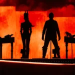 Nine Inch Noize performing live at Coachella 2026, four silhouettes against a blood-red smoke-filled stage