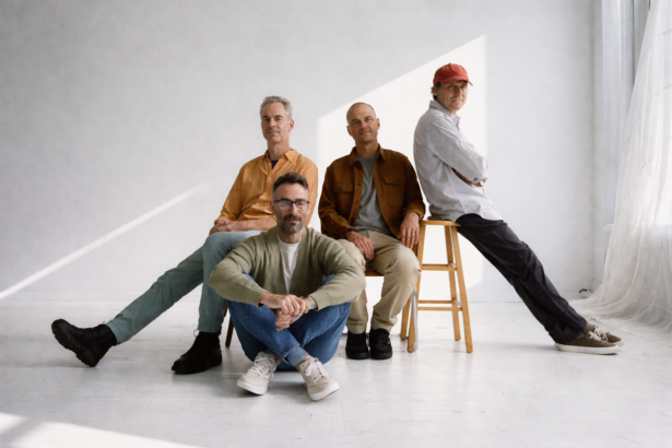 American Football pose in a bright white studio for their LP4 press photo, ahead of the album's May 1, 2026 release via Polyvinyl - LateTown