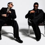 Chris Brown and Usher seated in chairs wearing black suits, laughing, R&B Tour 2026 press photo