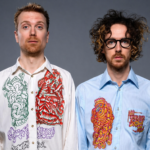 Ciao Lucifer duo posing in psychedelic illustrated shirts against a gray background - LateTown