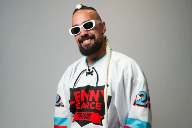 Lenny Pearce, Australian DJ behind the Disney Jr. Toddler Techno deal, wearing his signature Toddler Techno jersey and white sunglasses