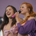 Olivia Rodrigo and Addison Rae laughing and singing together on stage at Coachella 2026.