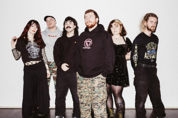 Sincere Engineer pose together against a white wall for a band promo photo ahead of their fourth album 'Probable Claws'