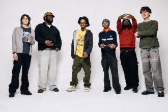 Six musicians pose against a white studio backdrop for the Earl Sweatshirt and Mike x Surf Gang collaborative project Pompeii Utility.