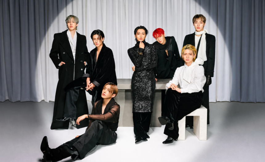 ATEEZ posing for an elegant high-fashion group portrait in black and white outfits during an editorial photoshoot ahead of their BST Hyde Park 2026 UK headline show