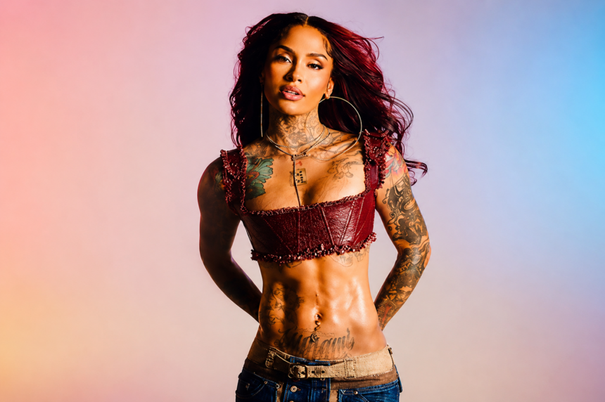 Kehlani in a red corset top and jeans, press photo for her 2026 self-titled album and North America world tour.