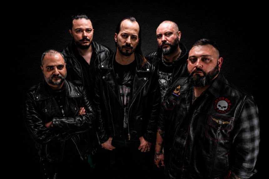 LIPFORD and Neverhush band members pose in leather jackets against a dark studio backdrop for their 2026 single 'The Music'