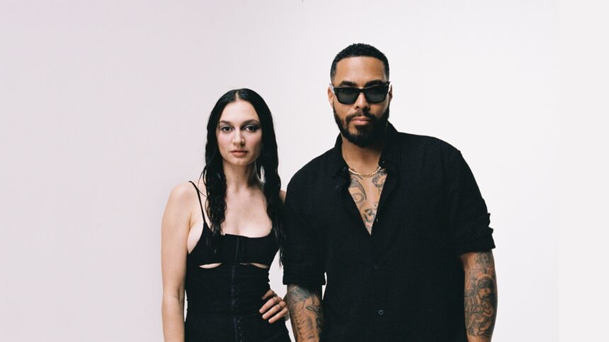 TroyBoi and Daya pose together in matching black outfits against a white backdrop for their 2026 single HUSH on Ultra Records