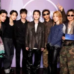 BTS all seven members RM Jin Suga j-hope Jimin V Jung Kook at 2026 American Music Awards backstage ahead of BTS Lyrics Inside and BTS Recipe Book announcement