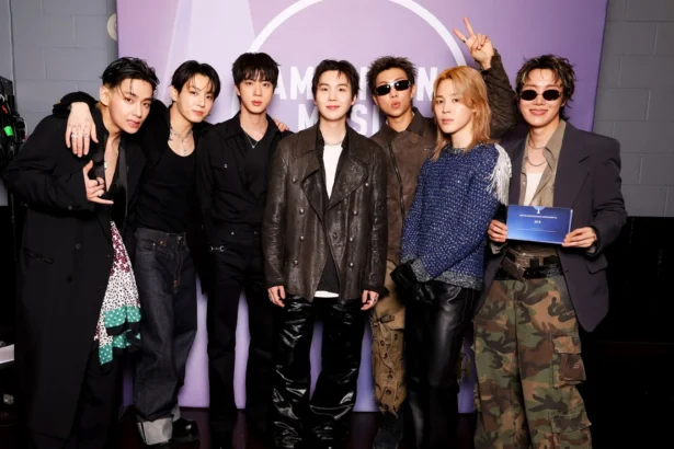 BTS all seven members RM Jin Suga j-hope Jimin V Jung Kook at 2026 American Music Awards backstage ahead of BTS Lyrics Inside and BTS Recipe Book announcement