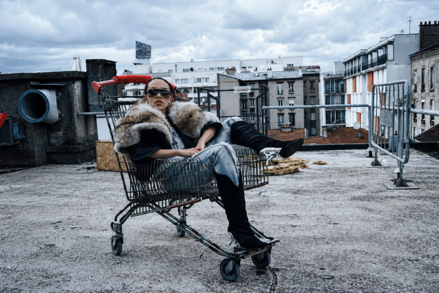 FKA twigs official press photo for On Your Mind single featuring Lil Yachty Atlantic Records June 2026 photographed on Paris rooftop in shopping cart