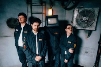 Holding Absence Cardiff post-hardcore band official press photo for Lucid Love single and Modern Life Is Lonely fourth album August 2026
