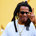Jay-Z photographed in 2026 wearing white t-shirt and gold chain ahead of Reasonable Doubt 30th anniversary Paris and Los Angeles concerts