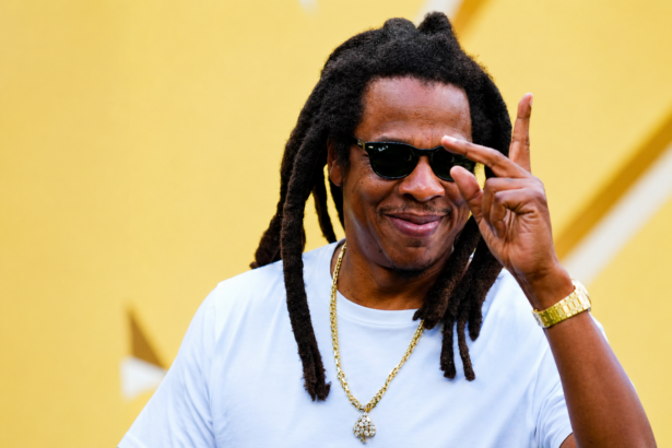 Jay-Z photographed in 2026 wearing white t-shirt and gold chain ahead of Reasonable Doubt 30th anniversary Paris and Los Angeles concerts