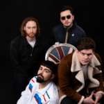 Stereo Silence Surrey UK indie rock band official press photo for Old Pair of Shoes single June 2026 featuring Union Jack chair