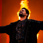 The Weeknd performing at After Hours Til Dawn Stadium Tour 2026 Etihad Stadium Manchester with dramatic fire production stage show