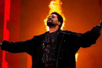 The Weeknd performing at After Hours Til Dawn Stadium Tour 2026 Etihad Stadium Manchester with dramatic fire production stage show