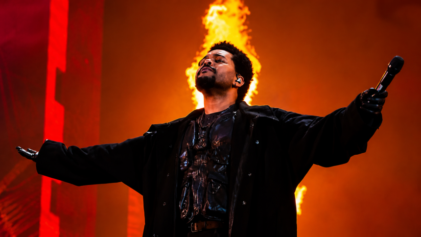 The Weeknd performing at After Hours Til Dawn Stadium Tour 2026 Etihad Stadium Manchester with dramatic fire production stage show