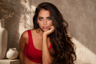 Yasmina Cherelle portrait in red outfit with aesthetic background