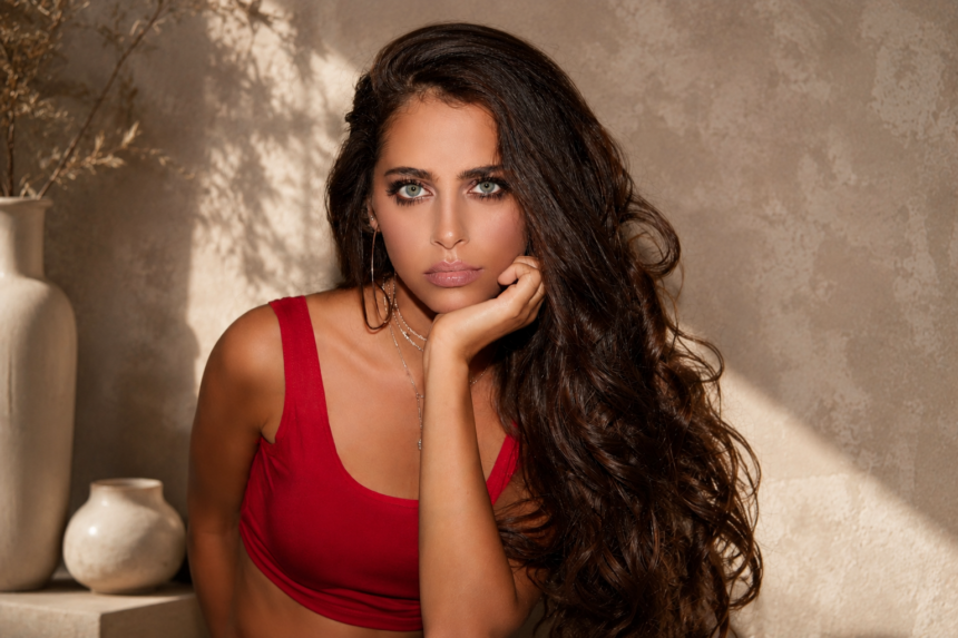 Yasmina Cherelle portrait in red outfit with aesthetic background