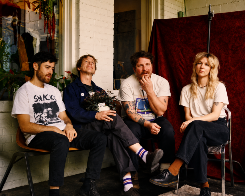 The four members of Atlanta indie rock band Ultra Lights sit together on a porch in a press photo for their debut album 'Pleasure's All Yours.'