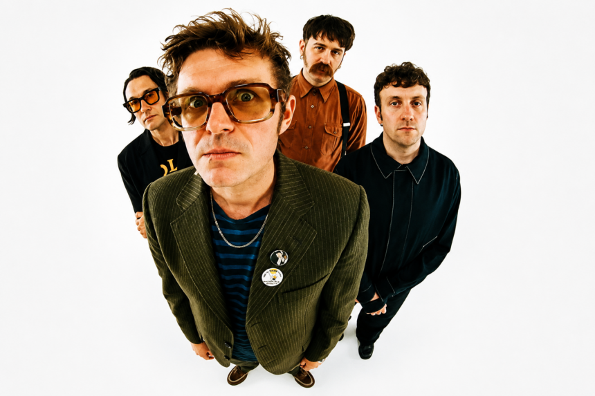 Yard Act band members photographed from above against a white background