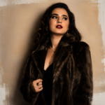 Singer Allison Amber Hage in a fur coat and red lipstick, evoking the classic vocal era behind her single Captured My Heart