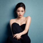 Blackpink's Jennie in a black strapless dress, promoting her single Less Than a Lover