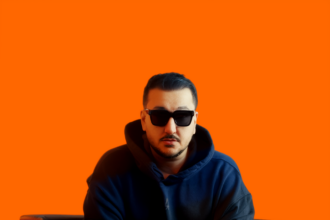 Daijo wearing a dark hoodie and sunglasses while seated in a black armchair against a vibrant orange background