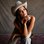 Kacey Musgraves sings karaoke in a neon-green room in the Mexico Honey music video