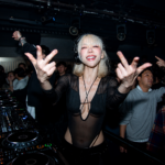 Lizzy Wang performs a DJ set to a packed club crowd