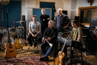 Teenage Fanclub photographed in black and white at Black Bay Studio surrounded by guitars, drums and a Moog synthesizer