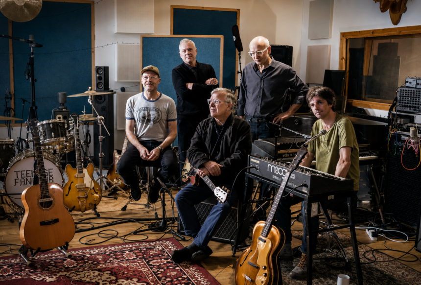 Teenage Fanclub photographed in black and white at Black Bay Studio surrounded by guitars, drums and a Moog synthesizer