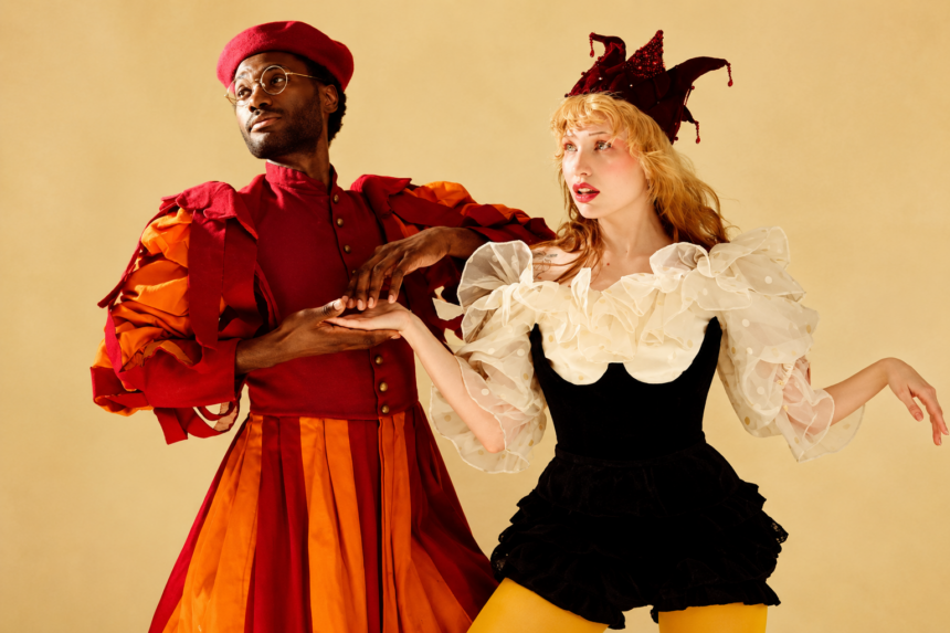 The duo Haute & Freddy pose in elaborate Renaissance-inspired court costumes against a warm beige backdrop, in press art for their single 'Touch Touch.'