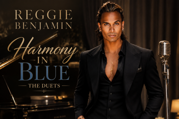 Album cover for Reggie Benjamin's 'Harmony In Blue: The Duets,' showing Benjamin in a black suit beside a grand piano and vintage microphone, featuring Lisa Vanderpump, Joe Mantegna and more.