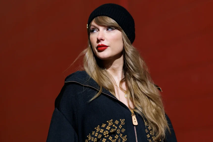 Taylor Swift walks through a desert at sunset in a flowing peach dress with pink-tipped hair, in press-style art tied to her Radio Songs No. 1 'I Knew It, I Knew You.'