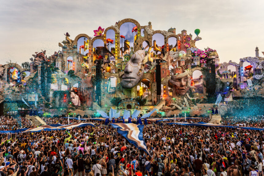 Tomorrowland 2026's record-breaking Consciencia mainstage, with its giant sculpted faces and arches, towers over the crowd in Boom, Belgium.