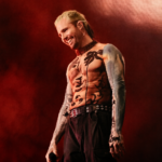What So Not performs live against a red-lit backdrop, smiling with a mic in hand and wearing a patterned mesh top, in press-style art tied to his new project and tour.