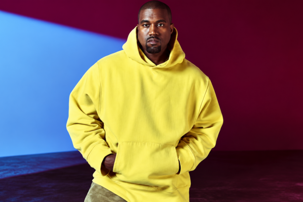 Ye poses in a yellow hoodie on a magazine cover, in an image tied to his 2026 stadium tour dates in Houston, Dallas and Phoenix.